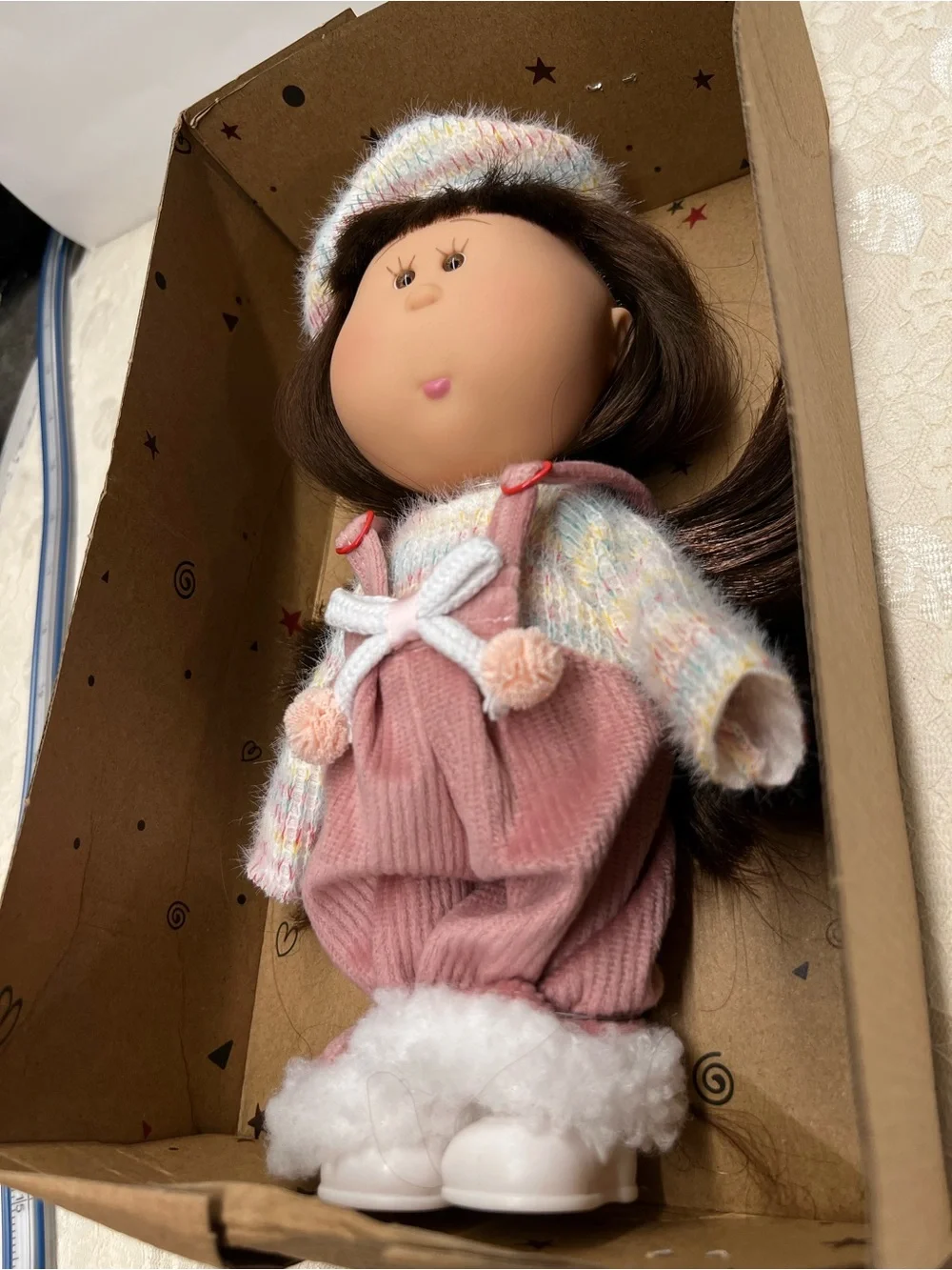 New, Mia Doll with Brown Hair Wearing a Pastel Sweater and Pink Overalls.